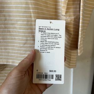 Size 6 Lululemon “Back in Action Long Sleeve”, new with tags. Relaxed fit